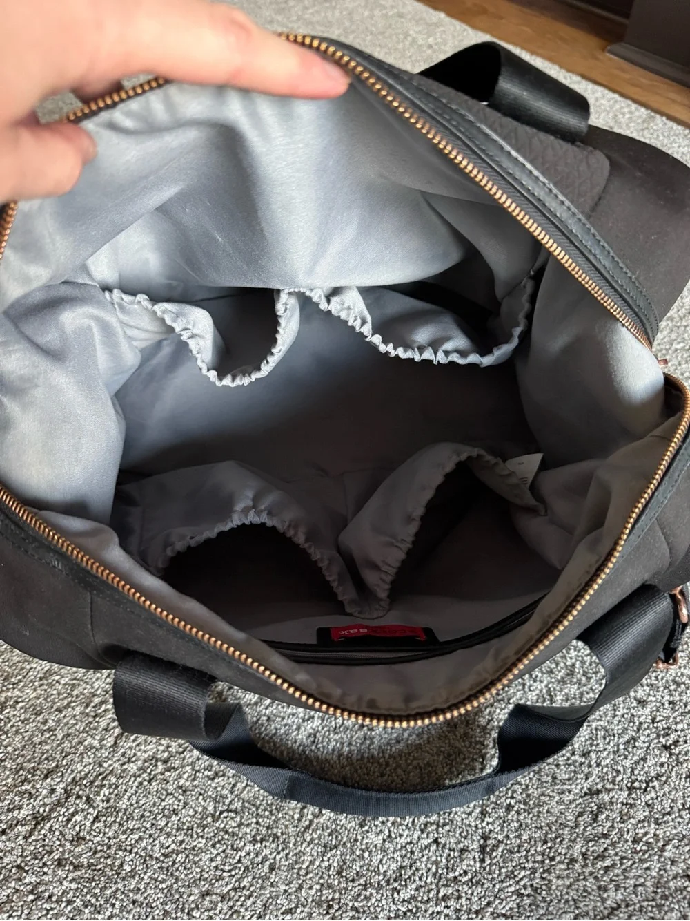 Storksak Black Quilted Baby Duffel with Rose Gold Zippers